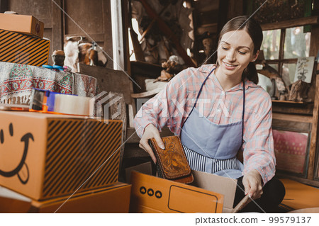 woman packing products order box send to customer freelance work for own business at home vintage tone woman packing products order box send to customer freelance work for own business at home vintage tone 99579137