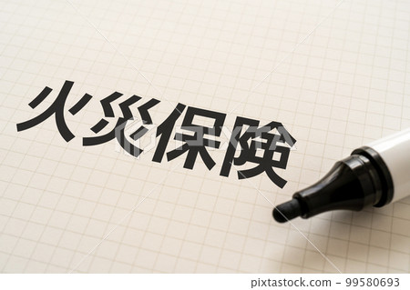 A notebook and a marker that says fire insurance 99580693