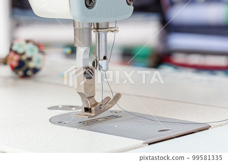 Sewing machine needle with thread and fabric Sewing machine needle with thread and fabric 99581335