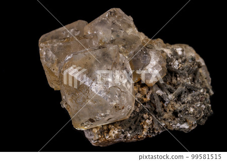 macro mineral fluorite stone on balck background 99581515