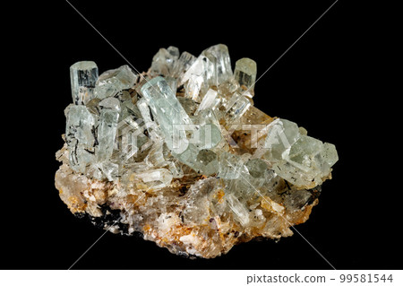 Macro mineral stone crystals Aquamarine in rock on a black background Macro mineral stone crystals Aquamarine in rock on a black background 99581544
