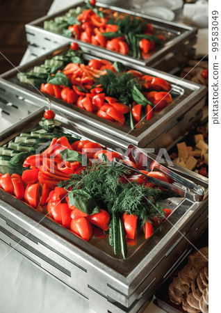 ready-made festive snacks tomatoes with greens on the buffet 99583049