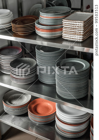 Clean dishes in the restaurant on the shelves Clean dishes in the restaurant on the shelves 99583513