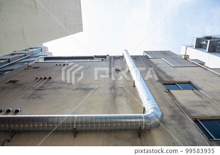 Sky looking up from an old building 99583935