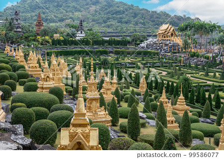 Golden stupas. Nong Nooch Tropical Garden. panorama view of Nong Nooch garden located at Pattaya, Thailand 99586077