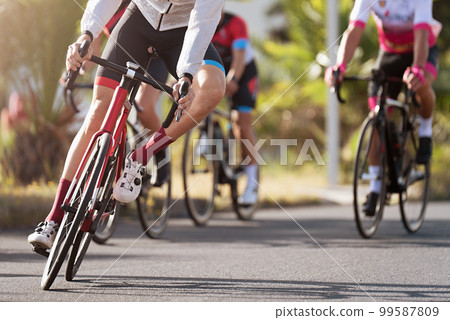 Cycling competition, cyclist athletes riding a race 99587809