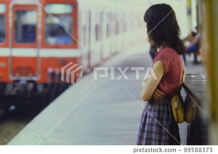 A woman sees off a express train passing Keikyu Heiwajima Station, June 20, 1982, EPD 99588373