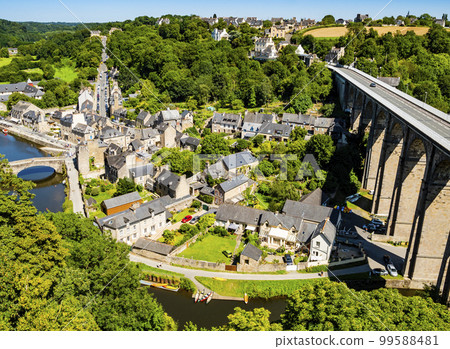 Impressive view of the port of Dinan with gothic bridge and viaduct over the river Rance, Cotes d'Armor department, Brittany, France 99588481