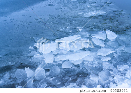 Ice frozen water on the river ice break debris 99588951