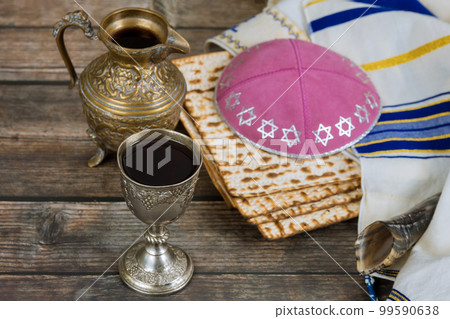 Passover festival is Jewish holiday in which unleavened bread matzah cup of kosher kiddush wine Passover festival is Jewish holiday in which unleavened bread matzah cup of kosher kiddush wine 99590638
