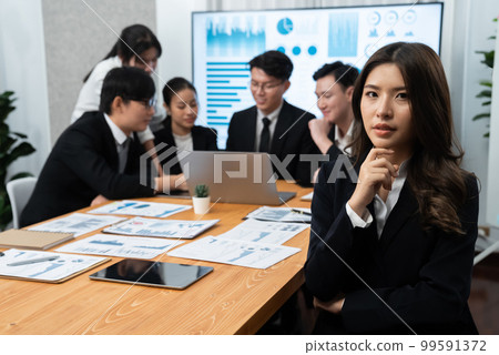 Focus portrait of asian female manger with blurred background in harmony. Focus portrait of asian female manger with blurred background in harmony. 99591372