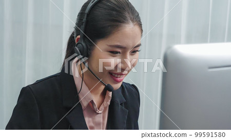 Enthusiastic female operator provide helpful customer service to customer. 99591580