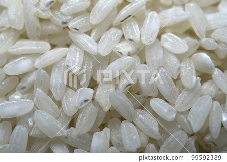 White rice close-up. Rice grains as a background. Dry rice. White rice close-up. Rice grains as a background. Dry rice. 99592389