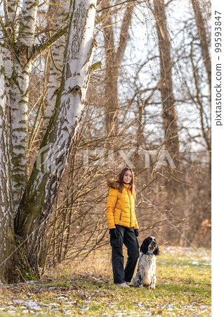 teenager in the park with a dog. english setter teenager in the park with a dog. english setter 99593847