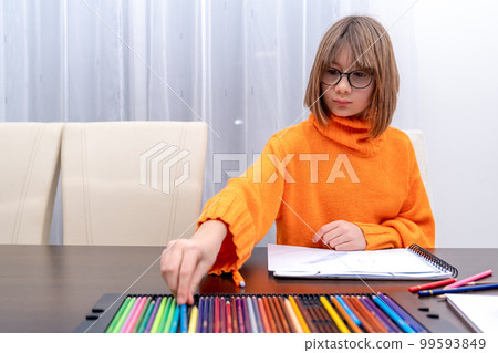 children draw on paper with different colored pencils children draw on paper with different colored pencils 99593849