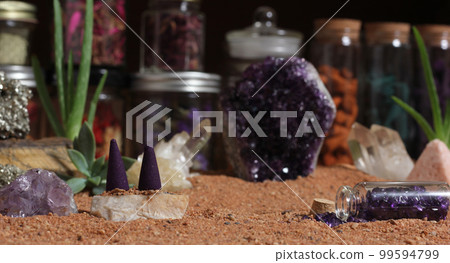 Amethyst Crystals and Chakra Stones on Australian Red Sand. Meditation Table Amethyst Crystals and Chakra Stones on Australian Red Sand. Meditation Table 99594799