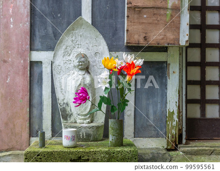 Stone statue of Ojizou san, protector of children, Hanibe caves, Japan. Stone statue of Ojizou san, protector of children, Hanibe caves, Japan. 99595561