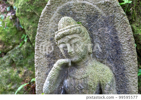 Stone statues of Ojizou san, protector of children, Hanibe caves, Japan. 99595577
