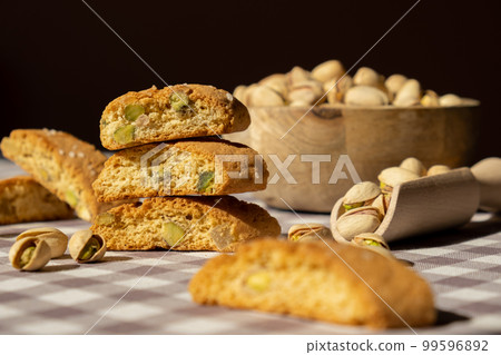 Biscotti Cantuccini Cookie Biscuits with pistachios and lemon peel Shortbread. Healthy eating food. Homemade fresh Italian cookies cantucci stacks and organic pistachios nuts. Vegan dieting 99596892