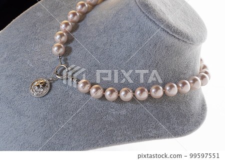 author beautiful  pearls necklaces demonstrated on maneken. fashion and jewelry concept author beautiful  pearls necklaces demonstrated on maneken. fashion and jewelry concept 99597551