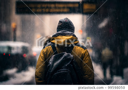 Man in the city walking at snow storm Man in the city walking at snow storm 99598050