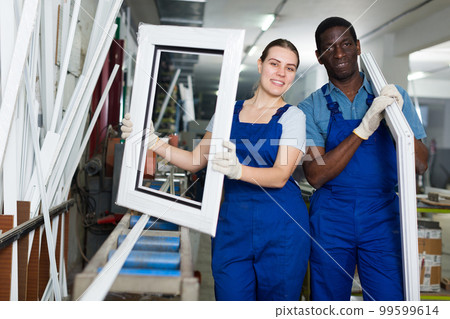 Adult masters are holding modern window frames Adult masters are holding modern window frames 99599614