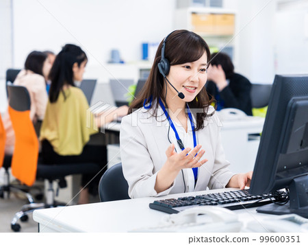 Woman having a remote meeting in the office Woman having a remote meeting in the office 99600351