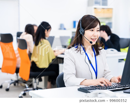 Woman having a remote meeting in the office Woman having a remote meeting in the office 99600352
