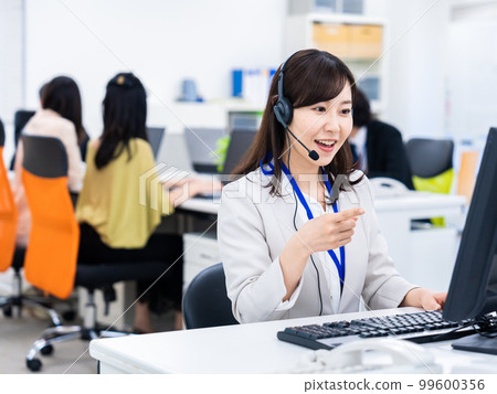 Woman having a remote meeting in the office Woman having a remote meeting in the office 99600356