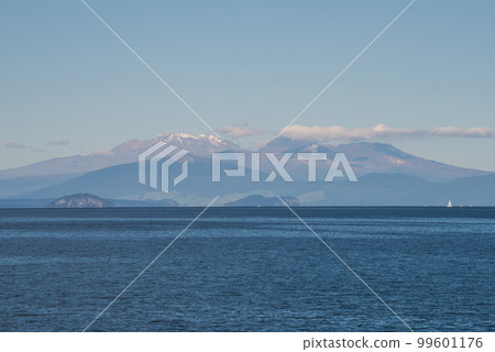 The scenery view of Tongariro national park view from lake Taupo the largest fresh water lake in New Zealand. 99601176
