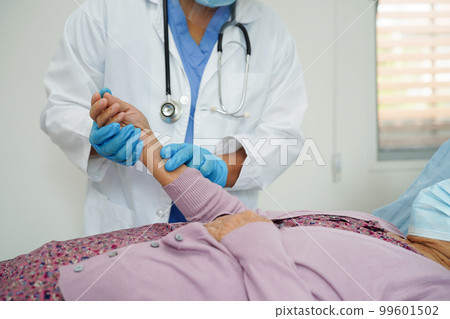 Doctor check Asian elder senior woman patient wearing a mask for protect covid coronavirus. Doctor check Asian elder senior woman patient wearing a mask for protect covid coronavirus. 99601502