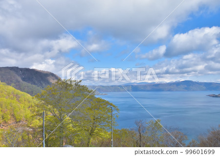 Aomori Lake Towada with blue sky and fresh greenery 99601699