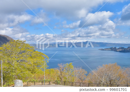 Aomori Lake Towada with blue sky and fresh greenery 99601701