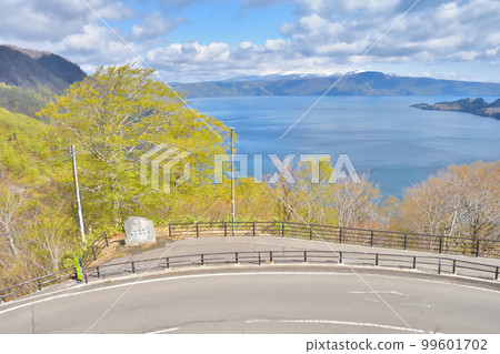 Aomori Lake Towada with blue sky and fresh greenery 99601702