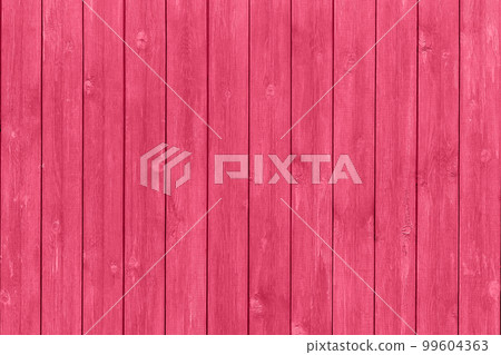 Trendy color of the year 2023. Wooden planks boards, vertical pattern, toned in viva magenta color as background or texture 99604363