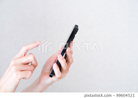 Hand tapping smartphone Hand tapping smartphone 99604521