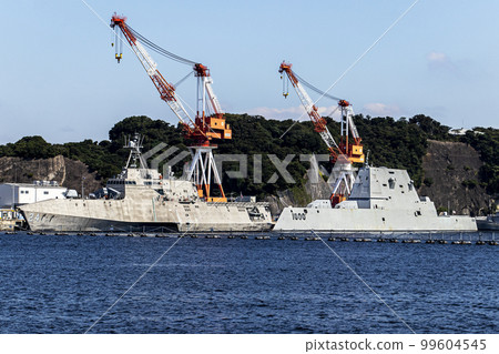 The U.S. Navy stealth ships Oakland and Zumwalt anchored and resupplying Yokosuka Air Base in Yokosuka City, Kanagawa Prefecture. 99604545