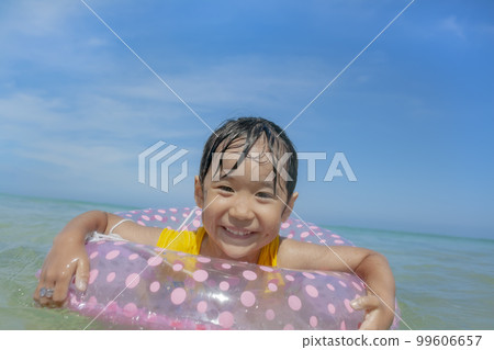 girl playing in the summer sea girl playing in the summer sea 99606657