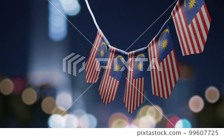 A garland of Malaysia national flags on an abstract blurred background A garland of Malaysia national flags on an abstract blurred background 99607725