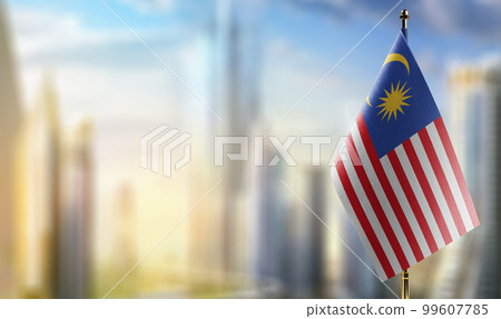 Small flags of the Malaysia on an abstract blurry background 99607785