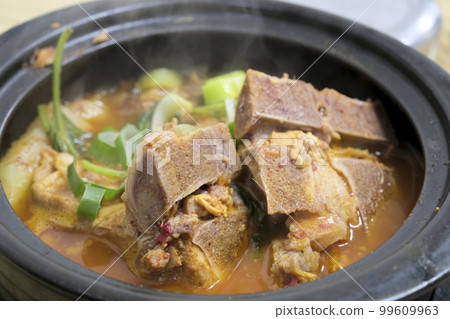 Spicy hot pot with pork and potatoes Spicy hot pot with pork and potatoes 99609963