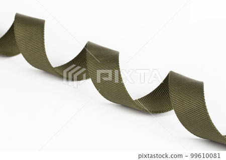 Fabric belt military, stretched like a spiral. Isolated on white background. Fabric belt military, stretched like a spiral. Isolated on white background. 99610081