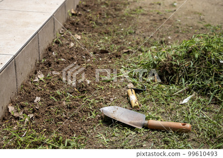 Weeding the garden Weeding the garden 99610493