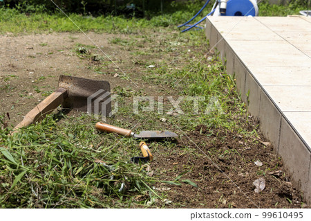 Weeding the garden Weeding the garden 99610495