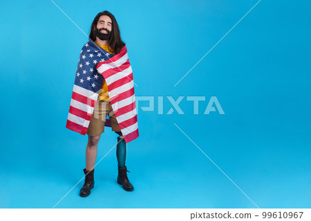 Man with prosthetic leg wrapped in a north america flag 99610967