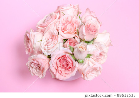 Delicate blooming pink flowers, blooming roses festive pink background, pastel Delicate blooming pink flowers, blooming roses festive pink background, pastel 99612533