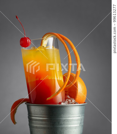 Cocktail tequila sunrise in a metal bucket with ice. 99613277