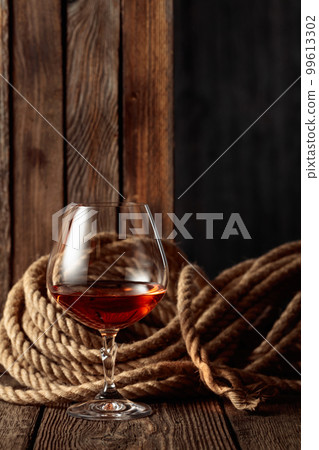 Snifter with rum, cognac, or whiskey Snifter with rum, cognac, or whiskey 99613302