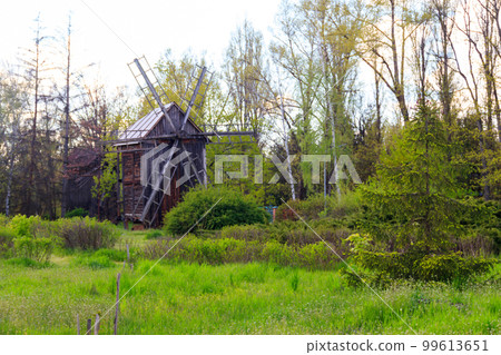 Old wooden windmill in Open-air Museum of Folk Architecture and Folkways of Middle Naddnipryanschina in Pereyaslav, Ukraine Old wooden windmill in Open-air Museum of Folk Architecture and Folkways of Middle Naddnipryanschina in Pereyaslav, Ukraine 99613651