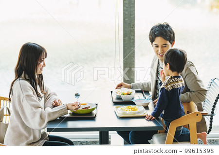 family eating out at a restaurant family eating out at a restaurant 99615398